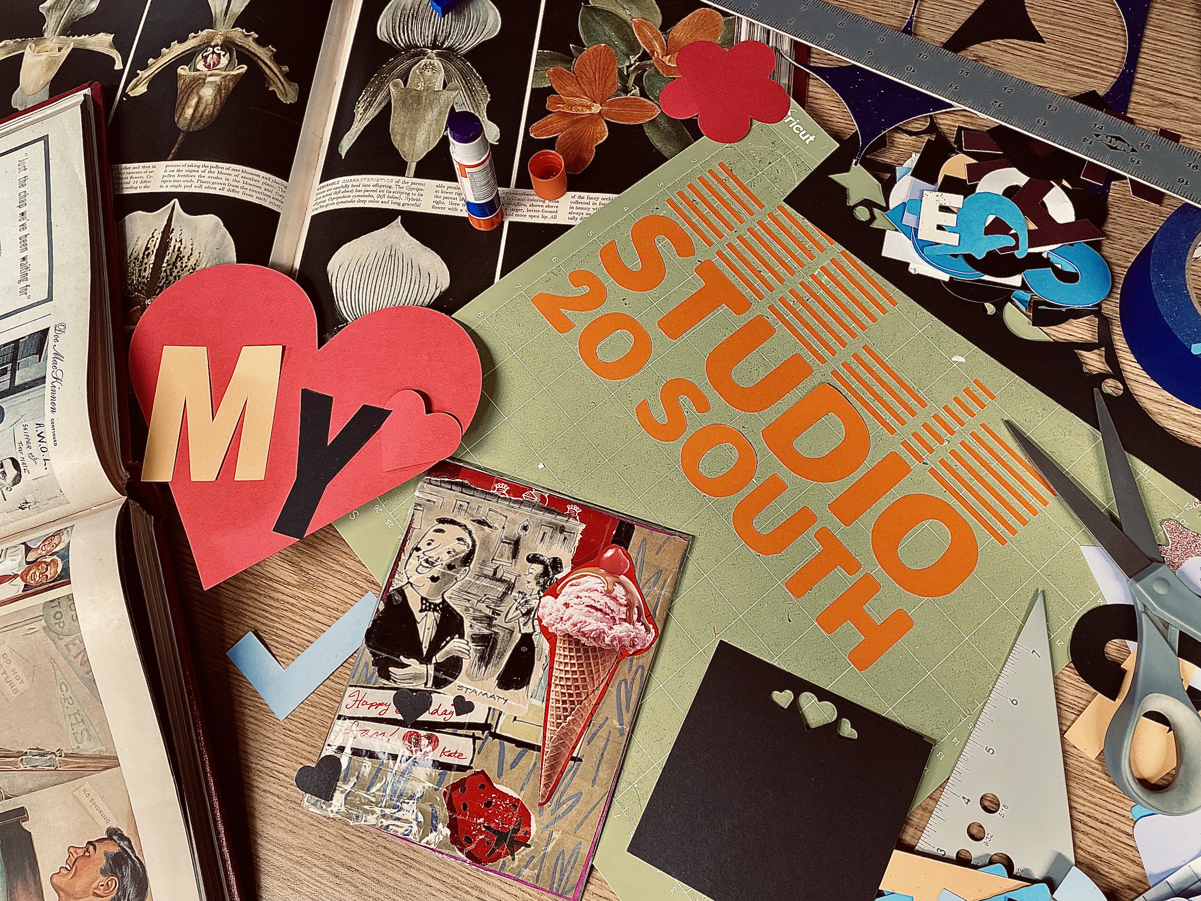 Image of paper scraps, scissors and other card-making collage items
