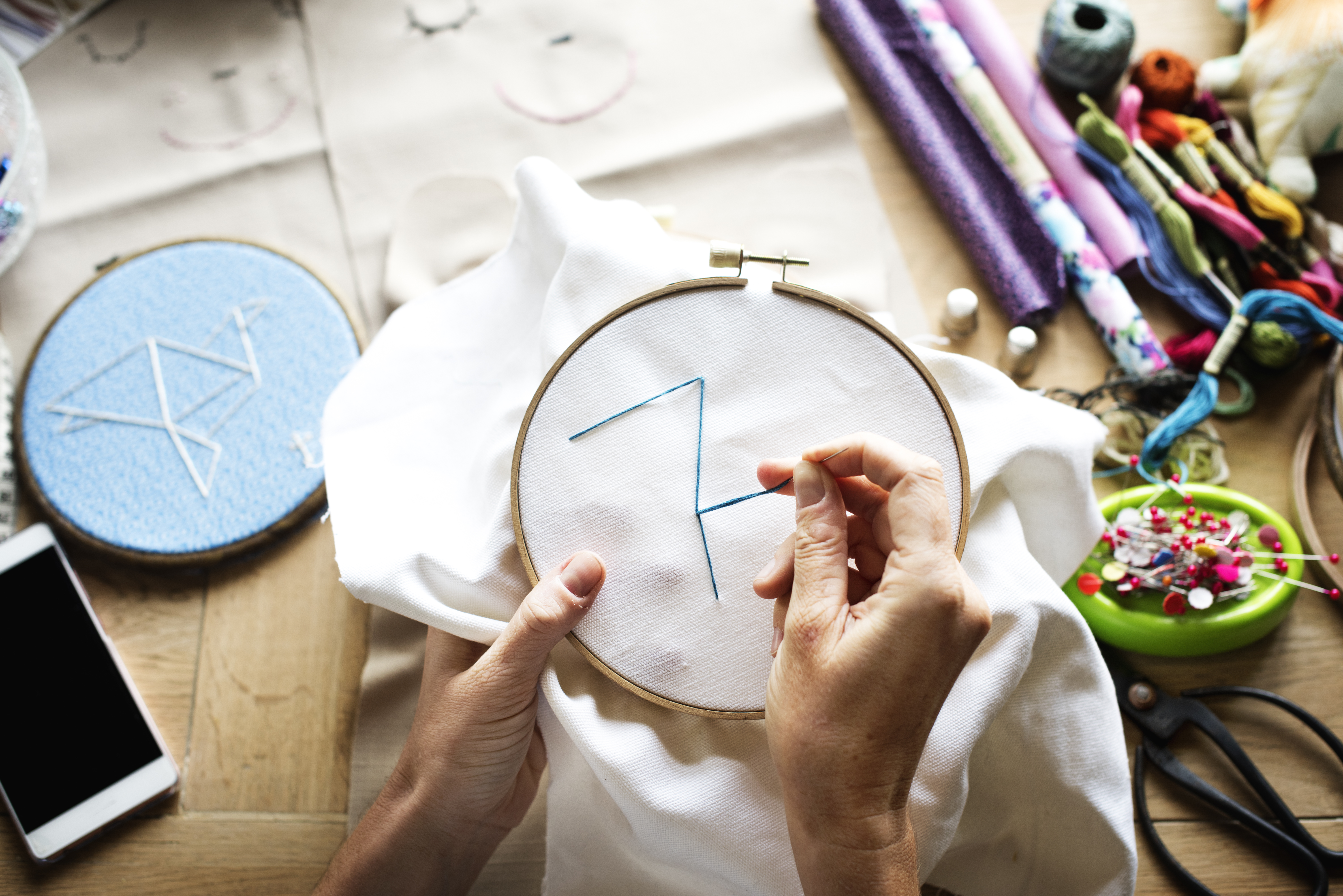 a person working on an embroidery project