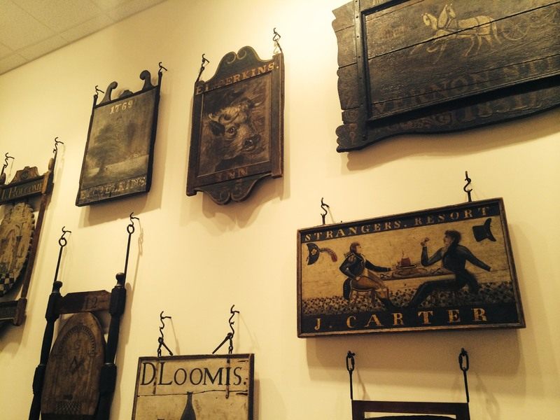 Array of antiquated tavern and Inn signs from museum display
