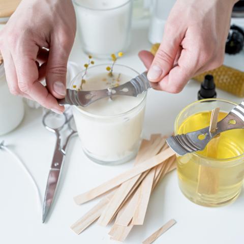 hands making candles