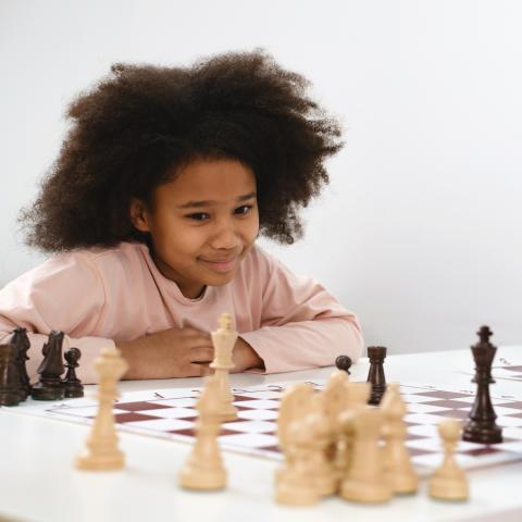 Young person playing chess