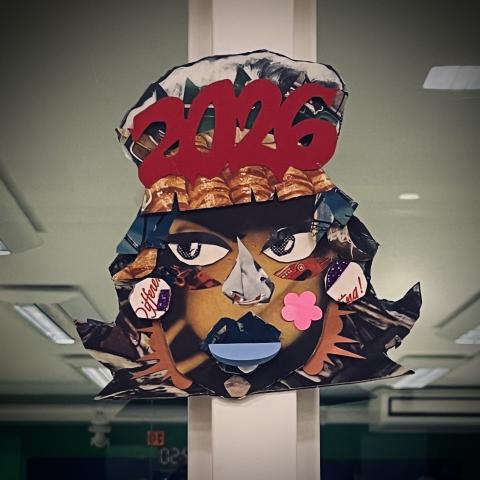 Cardboard portrait with collage-enhanced features