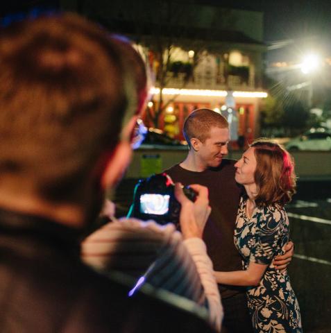image of someone taking photos of a couple.  Credit: Noni Fineberg