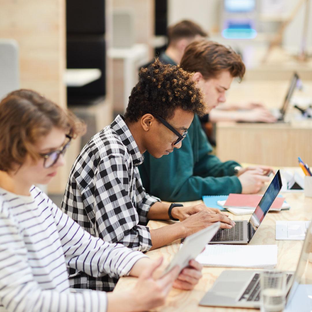 Photo - Teens working on laptops