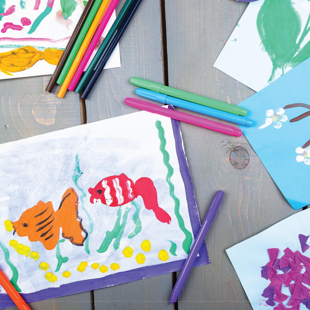 Photo of children's art work with supplies