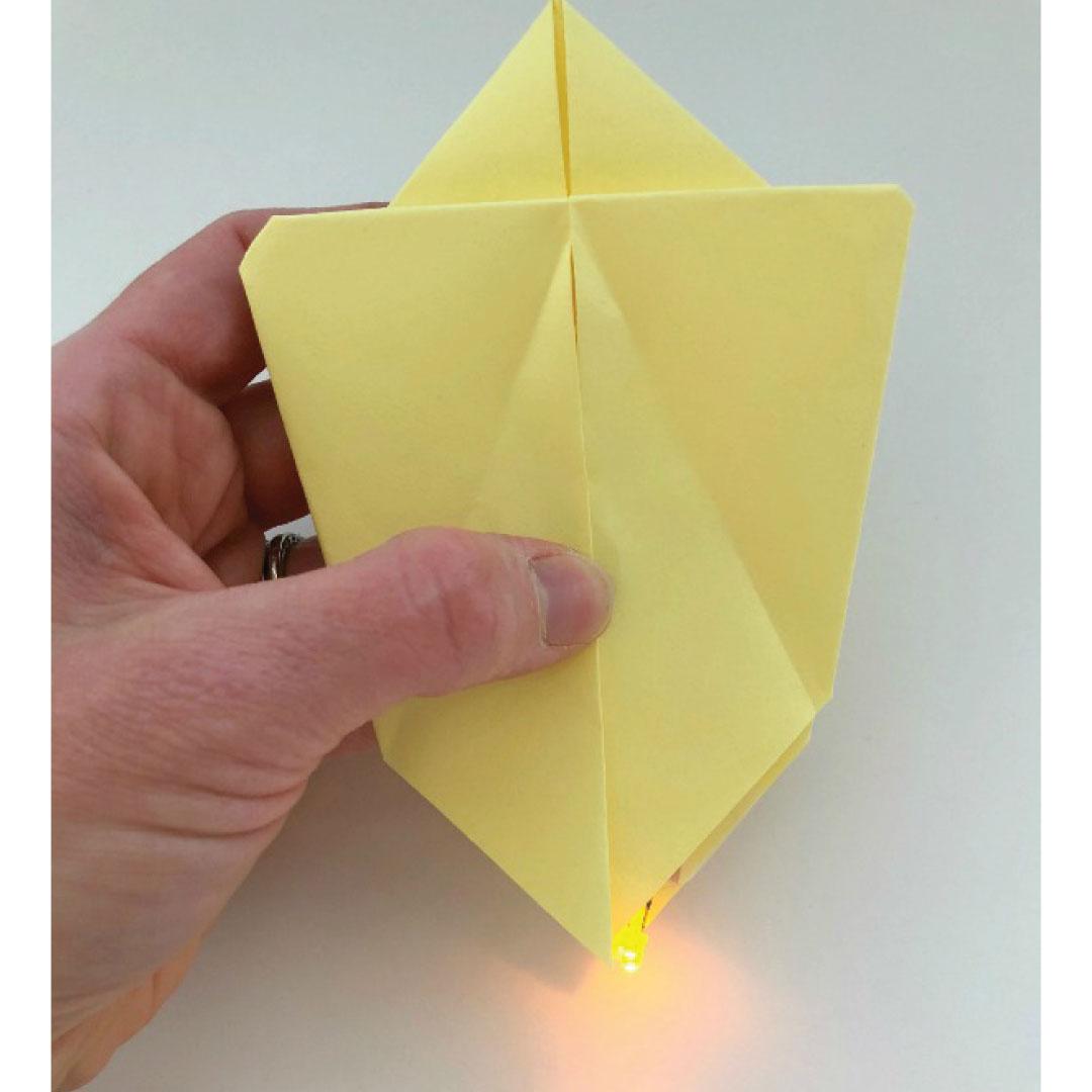 Origami folded paper with LED light - photo