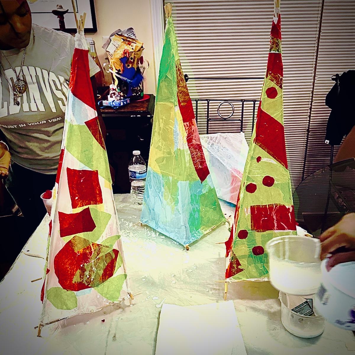 simple lanterns under construction made of paper and sticks